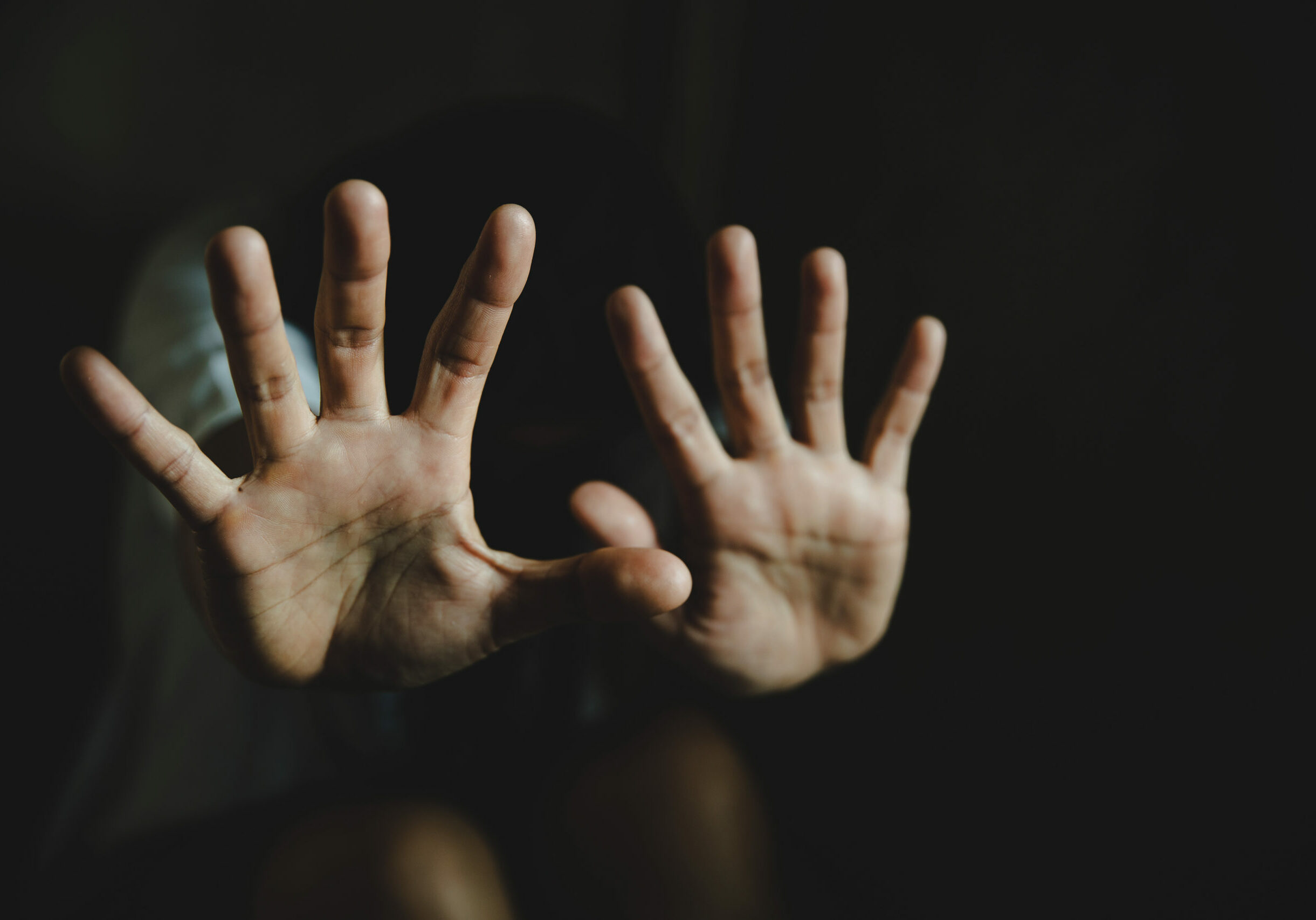 Abused young woman trying to hide and defend herself, Woman bondage in angle of abandoned building image blur , stop violence against Women, international women's day