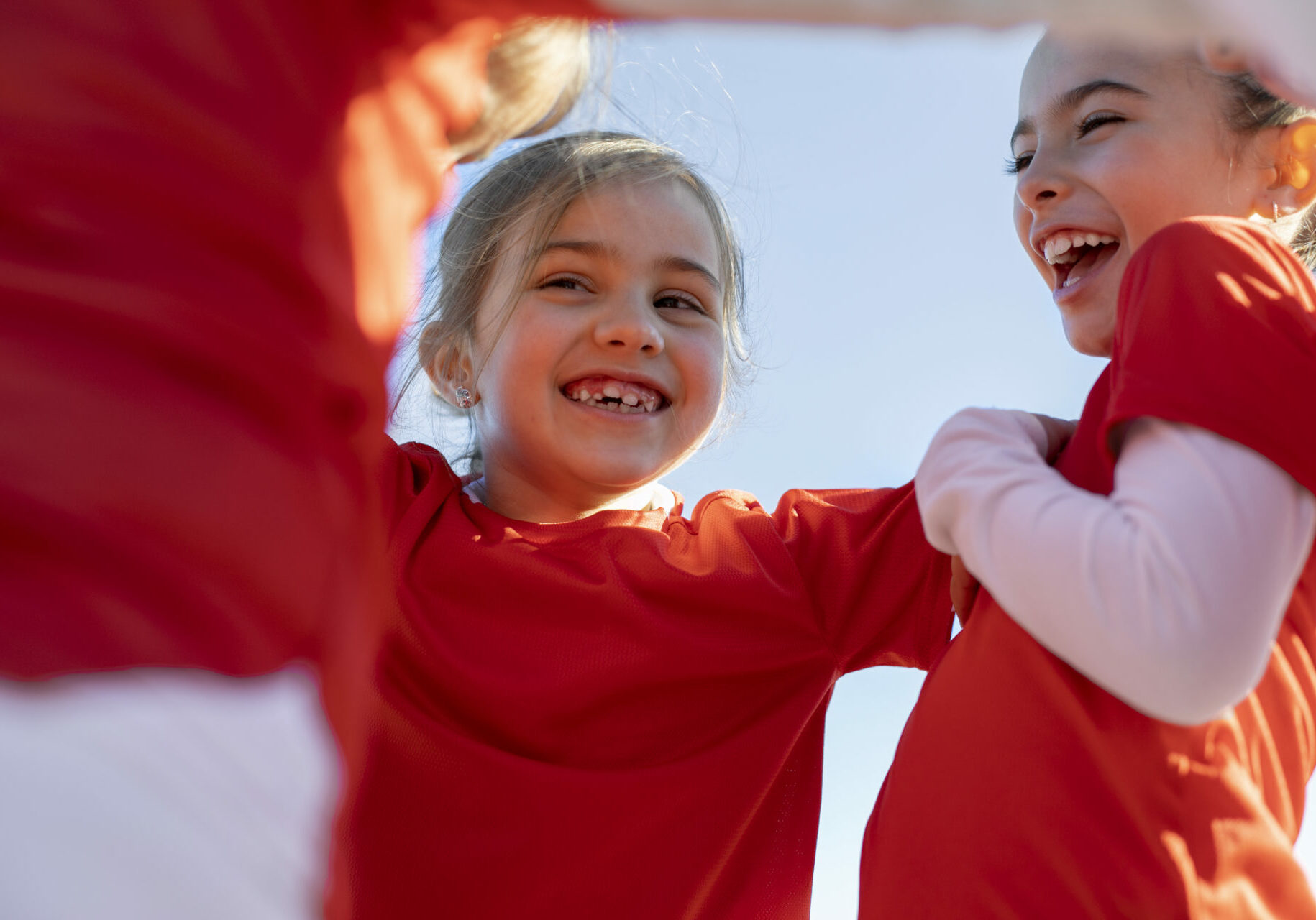 happy-girls-with-blue-sky-outdoors